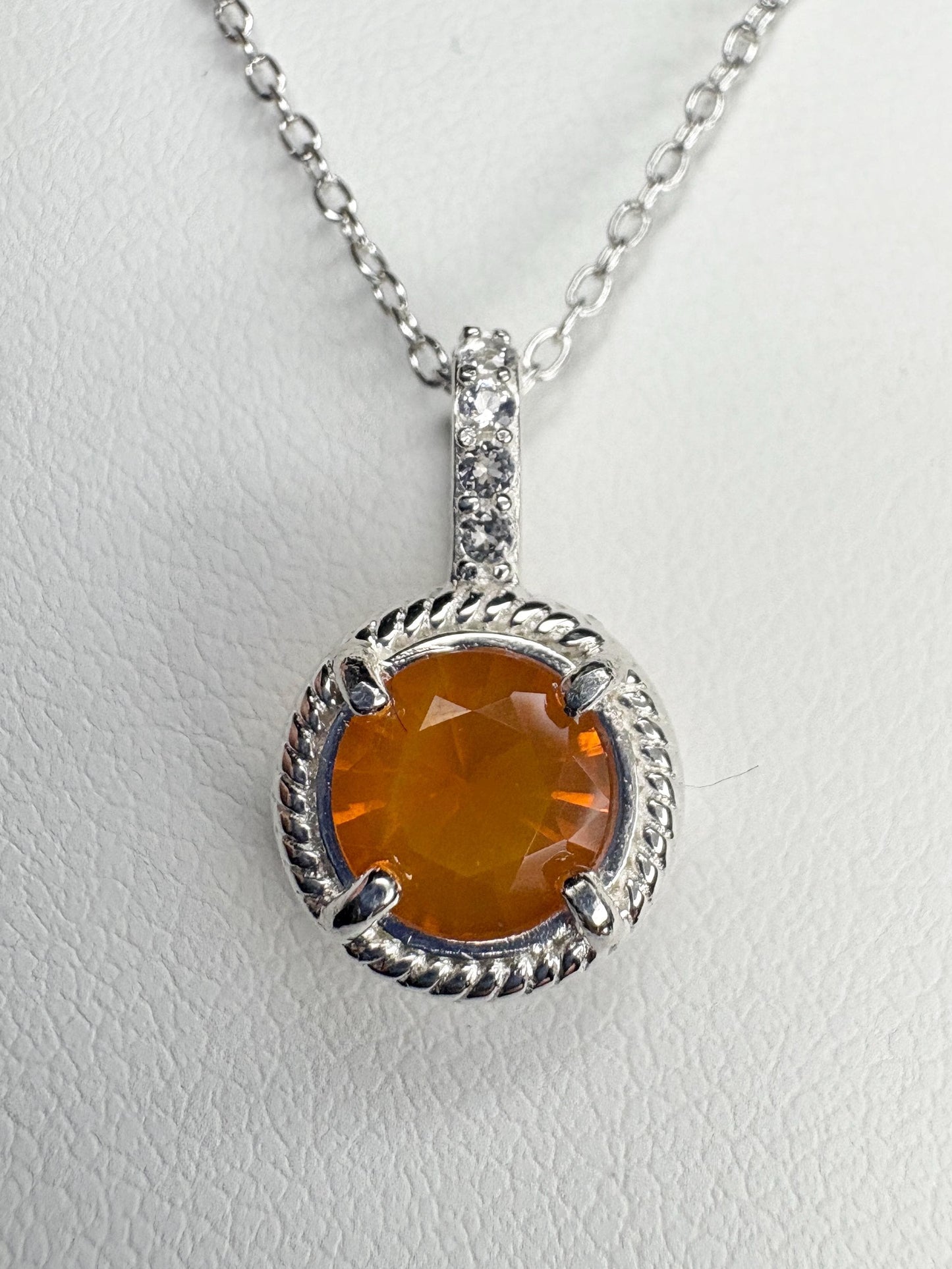 Sterling silver pendant necklace with a round Oregon fire opal and white topaz accents.