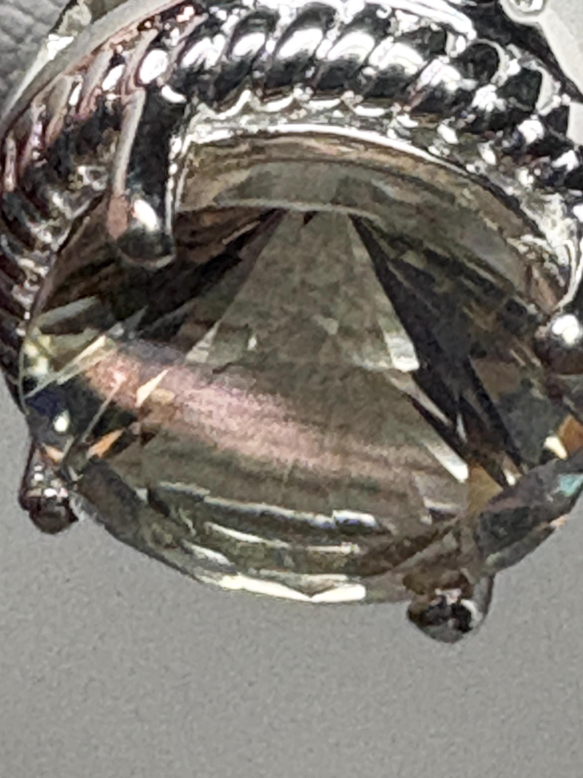 Sterling silver ring with a round Oregon sunstone and white topaz accents.