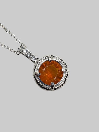 Sterling silver pendant necklace with Oregon fire opal and white topaz accents.