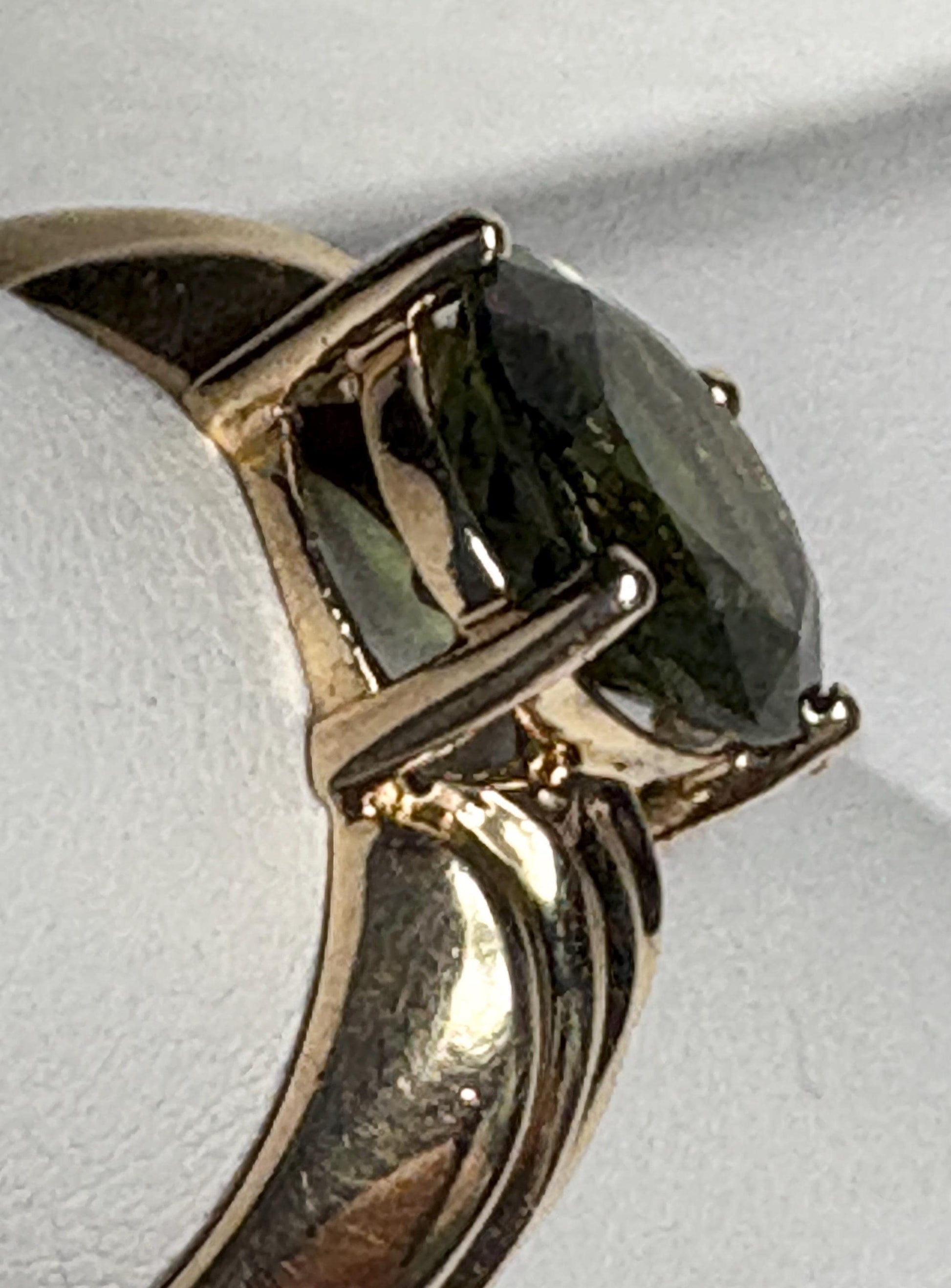 Ring with oval moldavite in solid 14k gold.