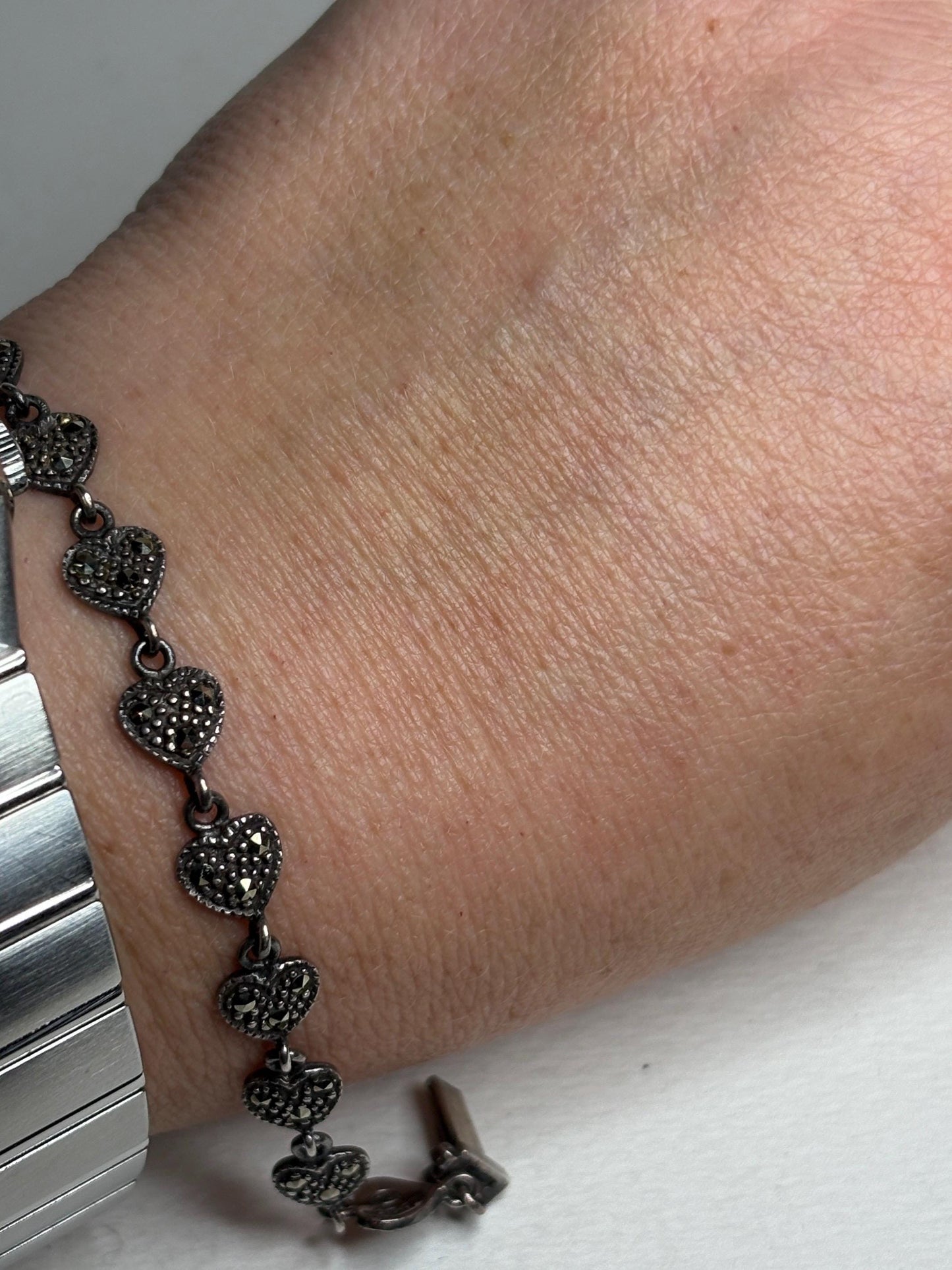 Sterling silver bracelet with oxidized marcasite heart links.