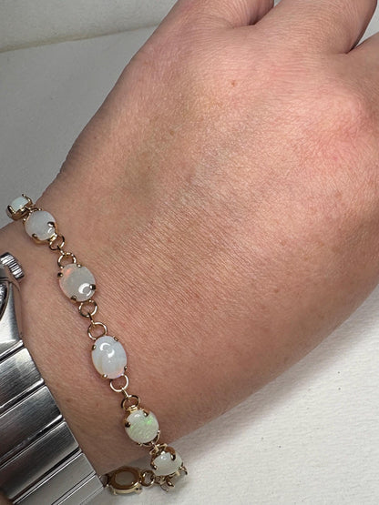Gold plated tennis bracelet with oval Australian opals.