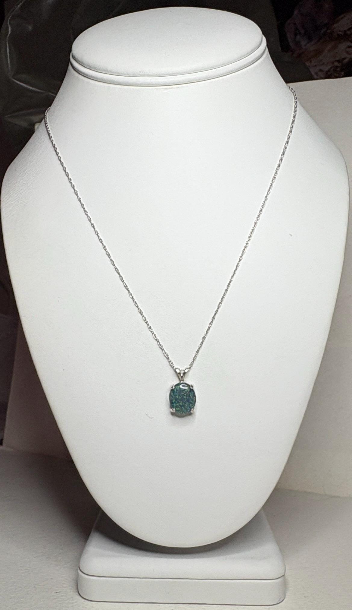 Sterling silver necklace with an oval Australian opal triplet pendant.