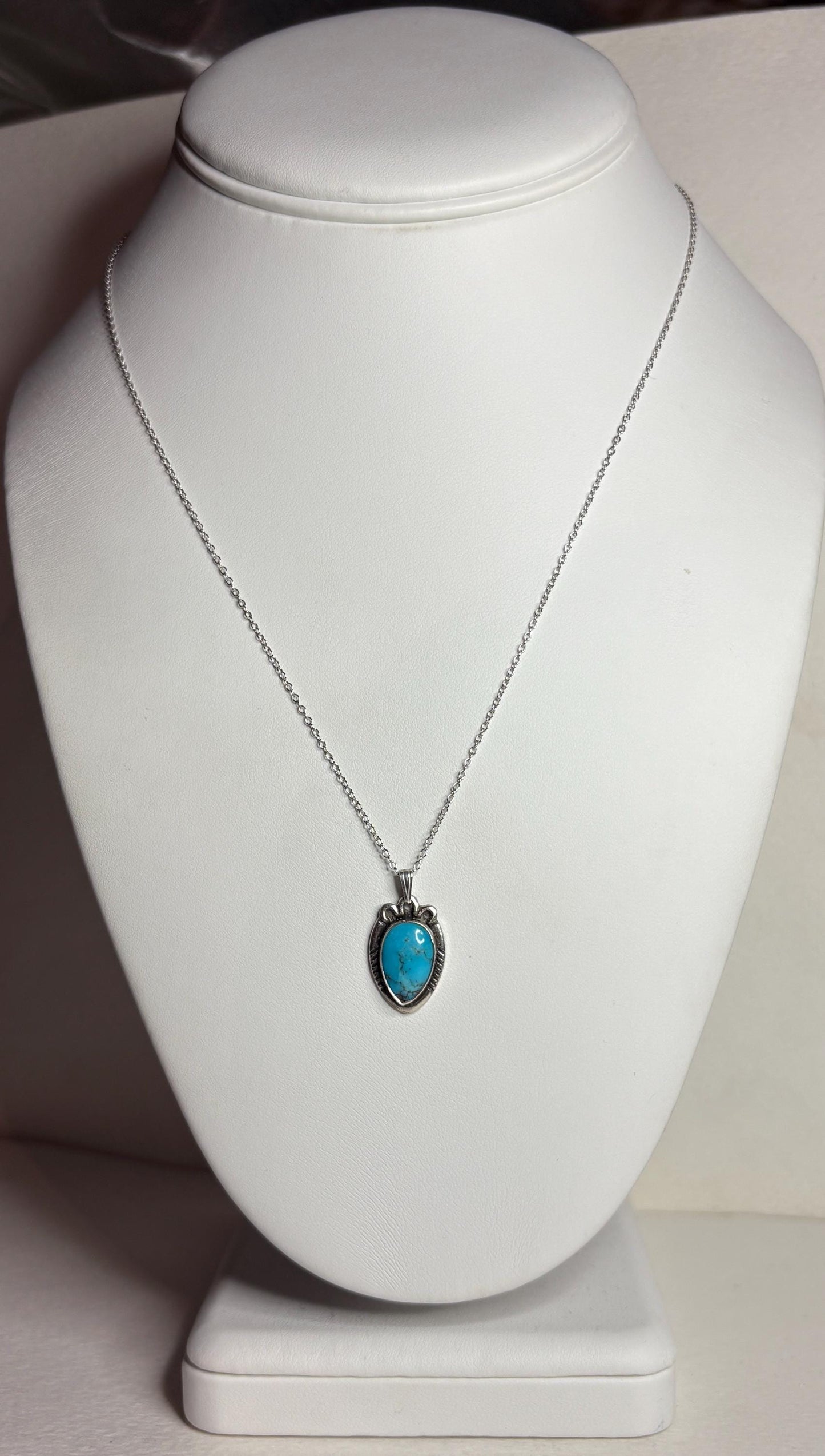 Vintage Southwest style necklace with natural turquoise pendant and adjustable chain.