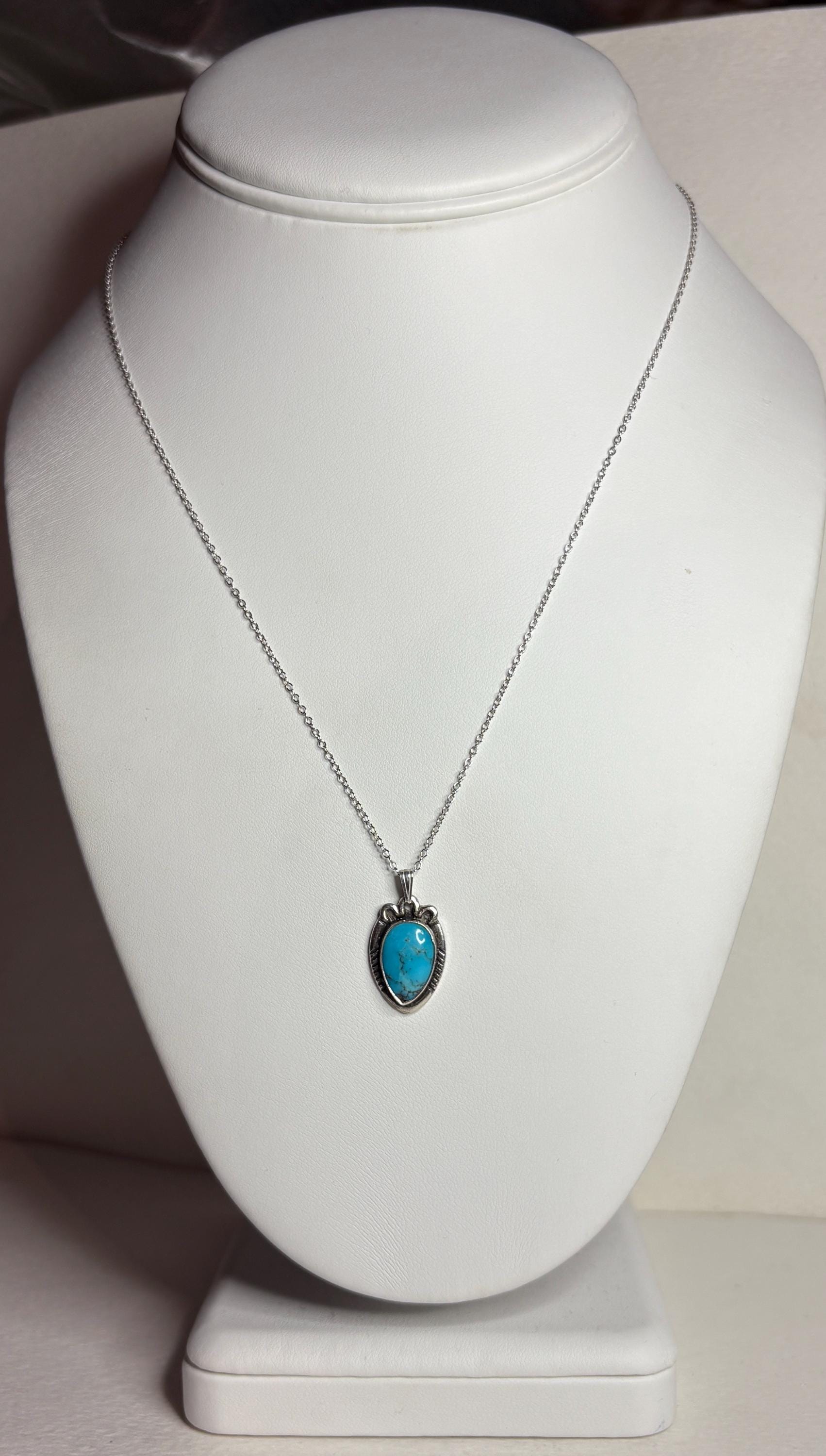 Vintage Southwest style necklace with natural turquoise pendant and adjustable chain.