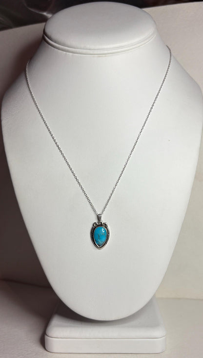 Vintage Southwest style necklace with natural turquoise pendant and adjustable chain.