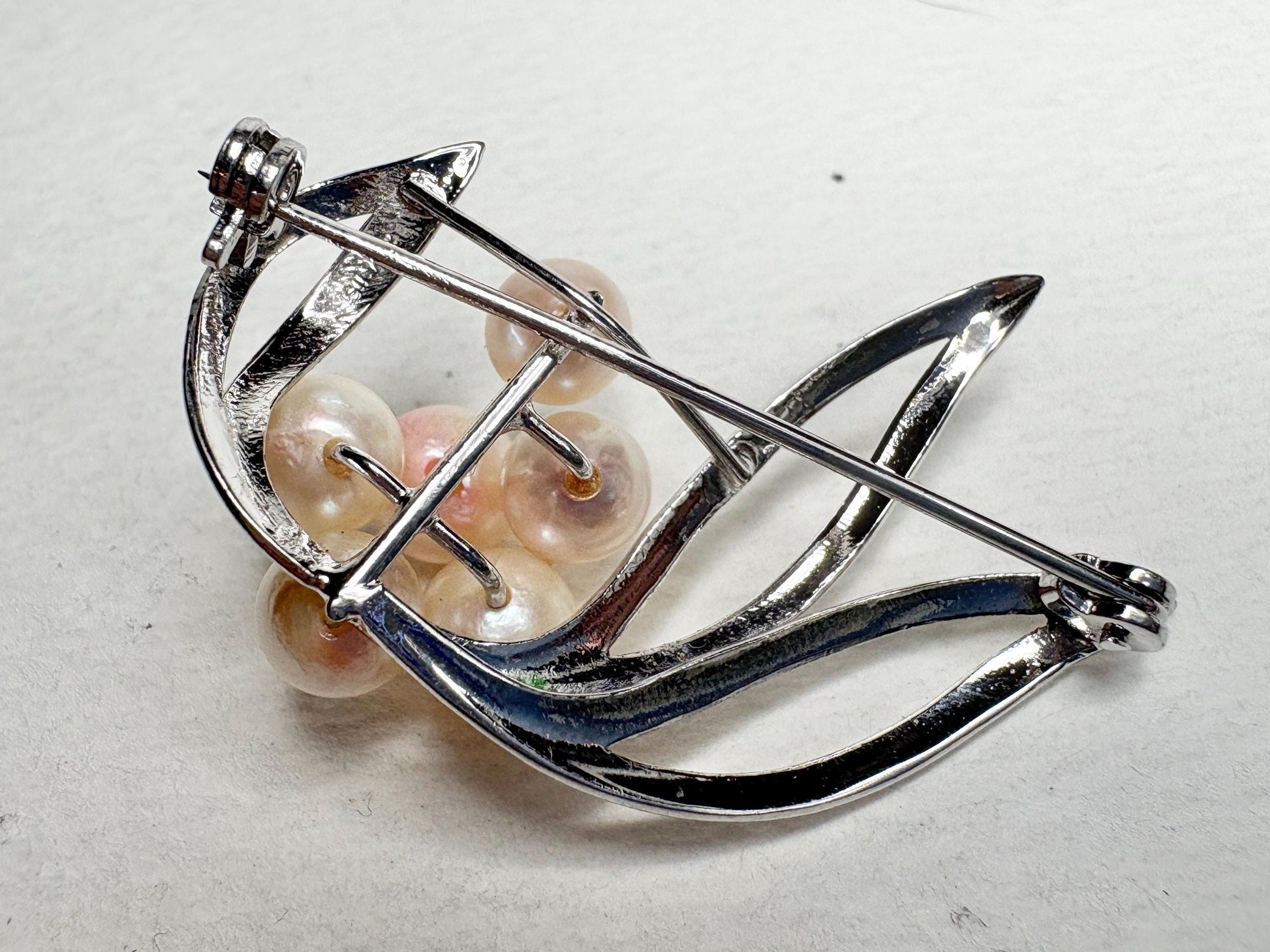 Vintage sterling silver brooch with Akoya cultured pearls.