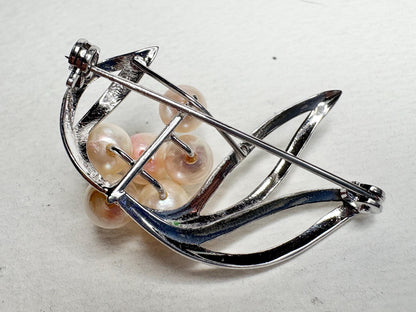 Vintage sterling silver brooch with Akoya cultured pearls.
