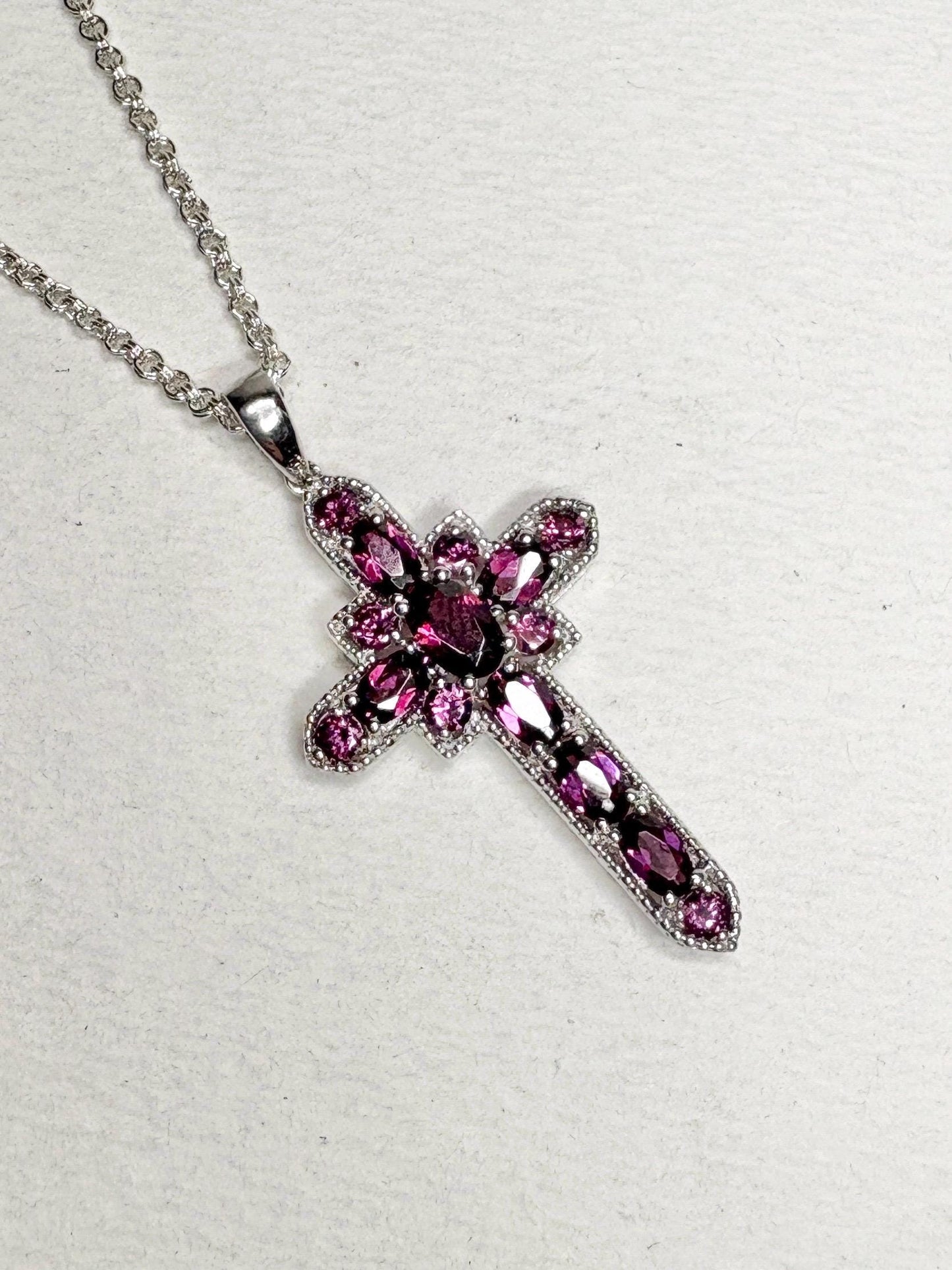 Sterling silver cross pendant necklace with rhodolite garnets.