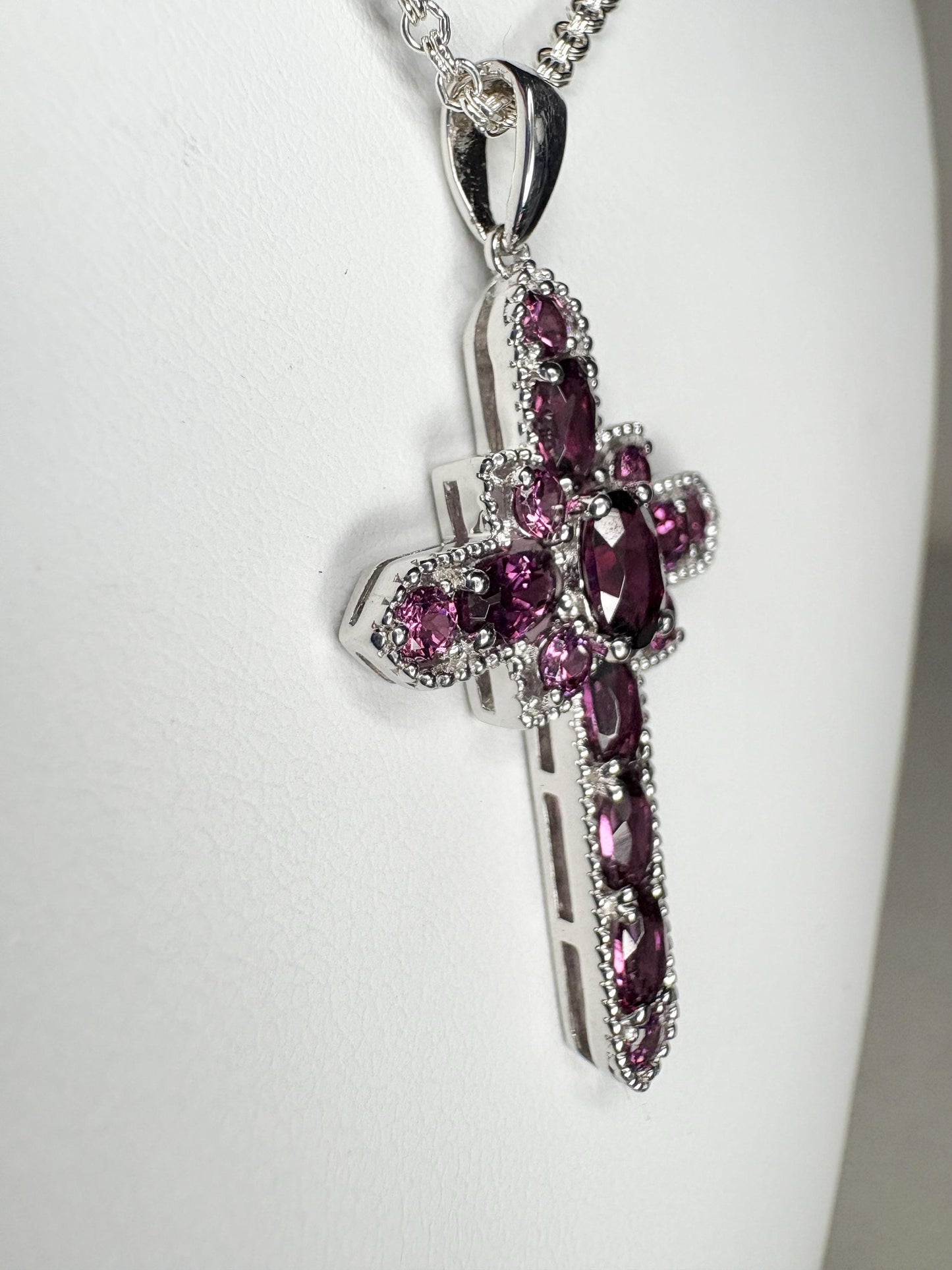 Sterling silver cross pendant necklace with rhodolite garnets.