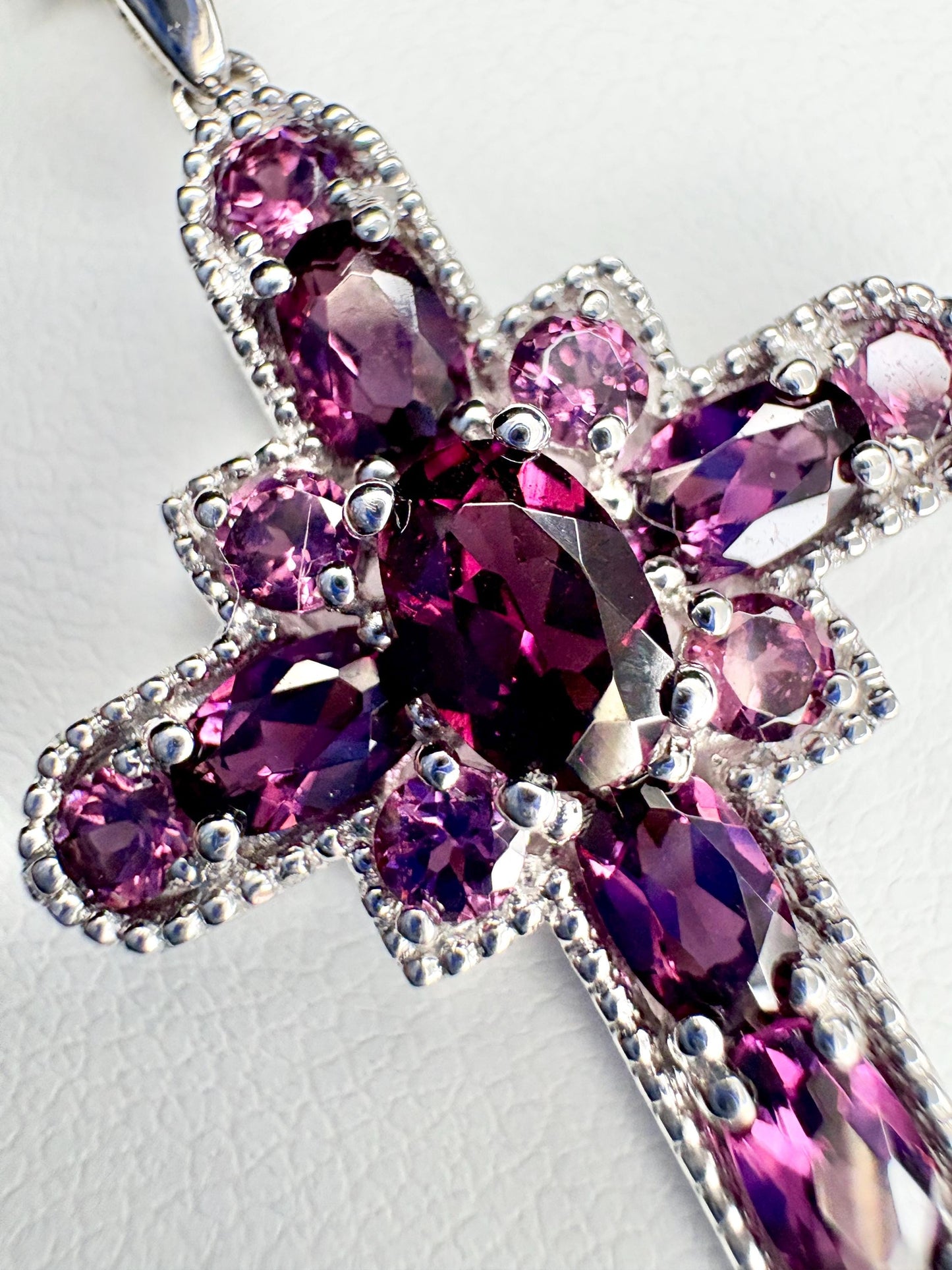 Sterling silver cross pendant necklace with rhodolite garnets.