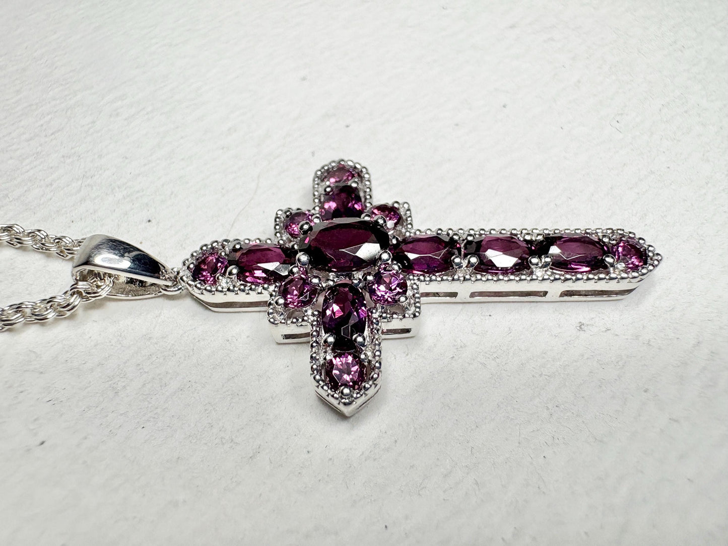 Sterling silver cross pendant necklace with rhodolite garnets.