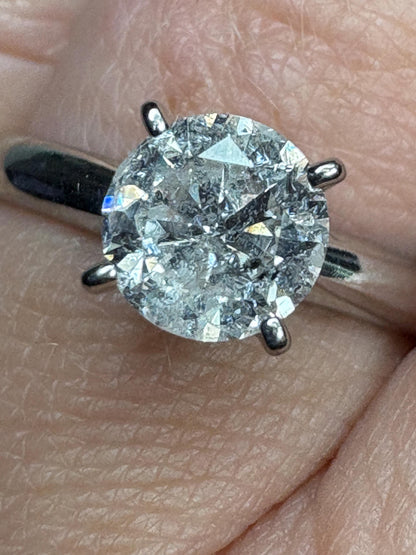 A 1ct round natural diamond solitaire ring in solid 10k white gold.