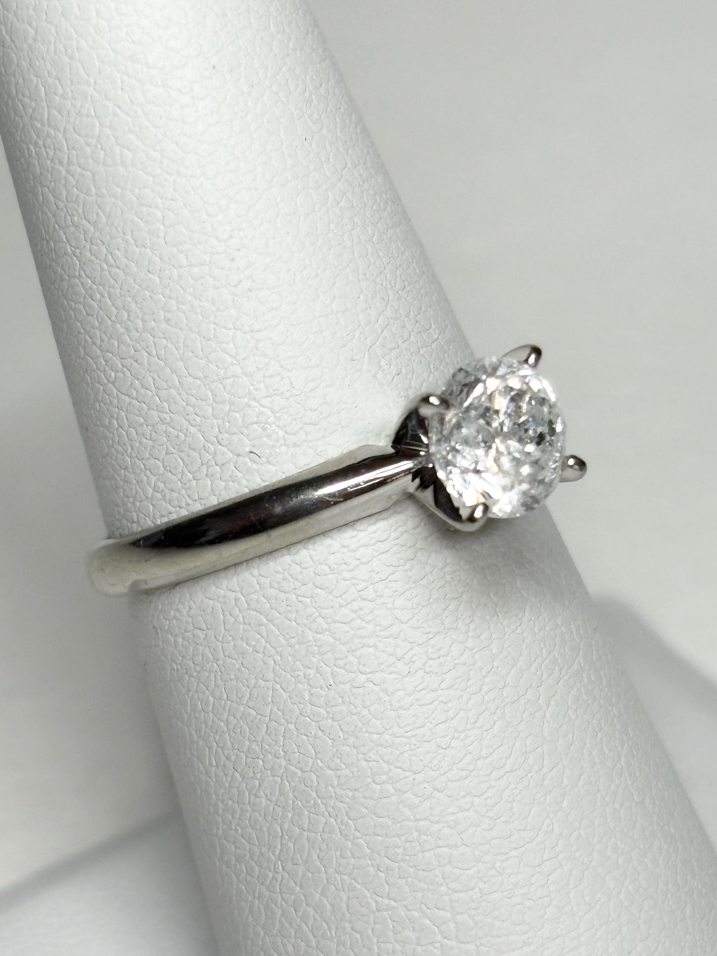 10k white gold ring with a 1ct round diamond solitaire.