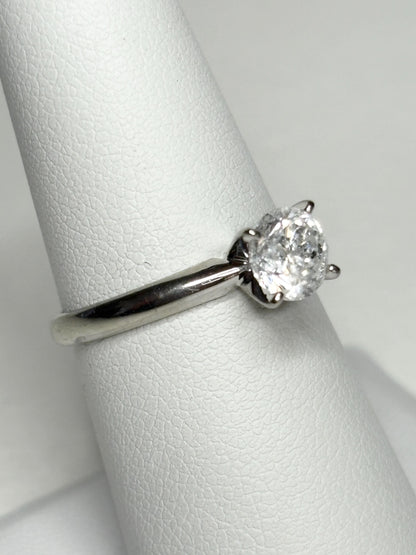 10k white gold ring with a 1ct round diamond solitaire.