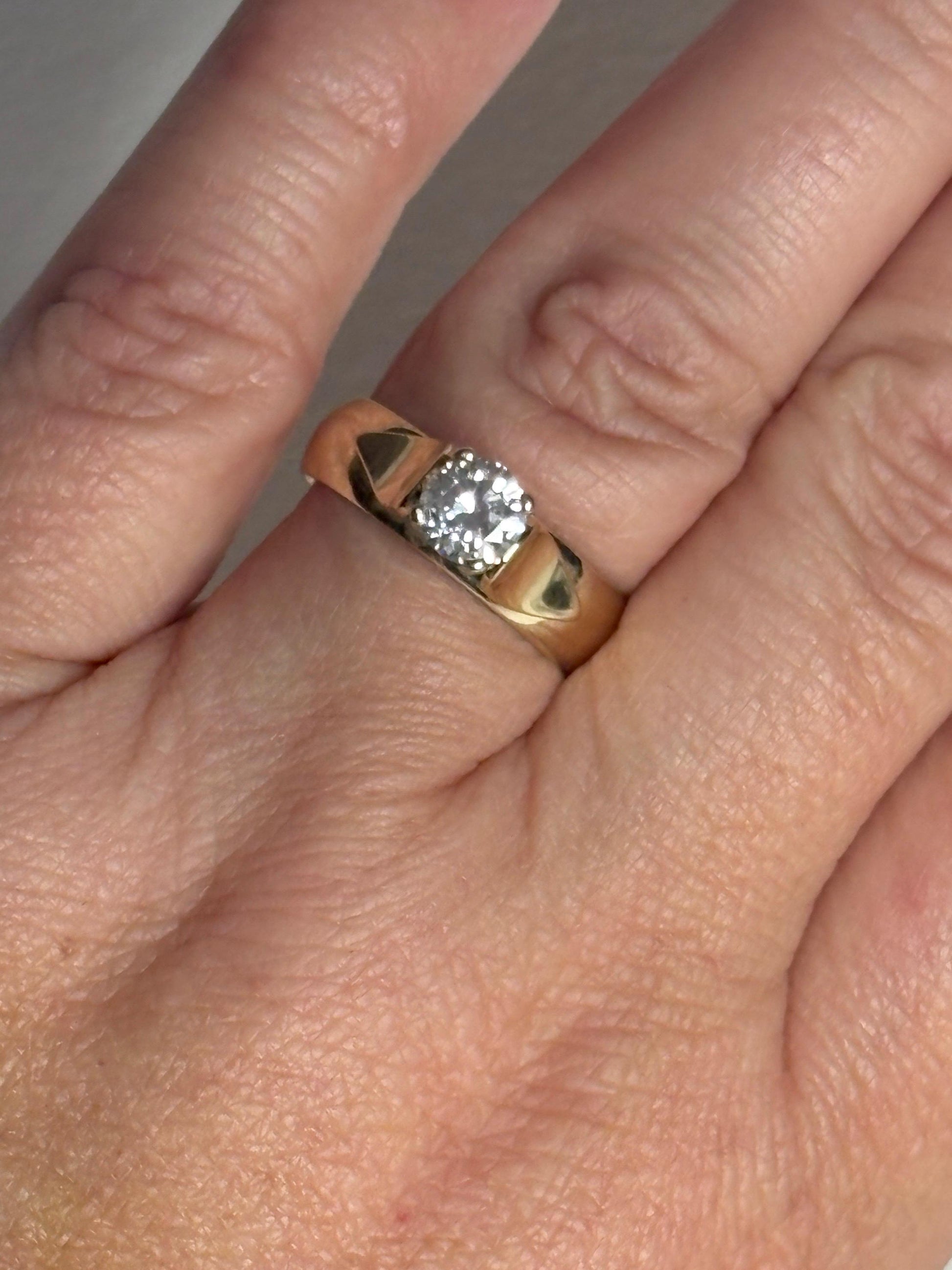 Vintage 14k gold band ring with a .75ct diamond.