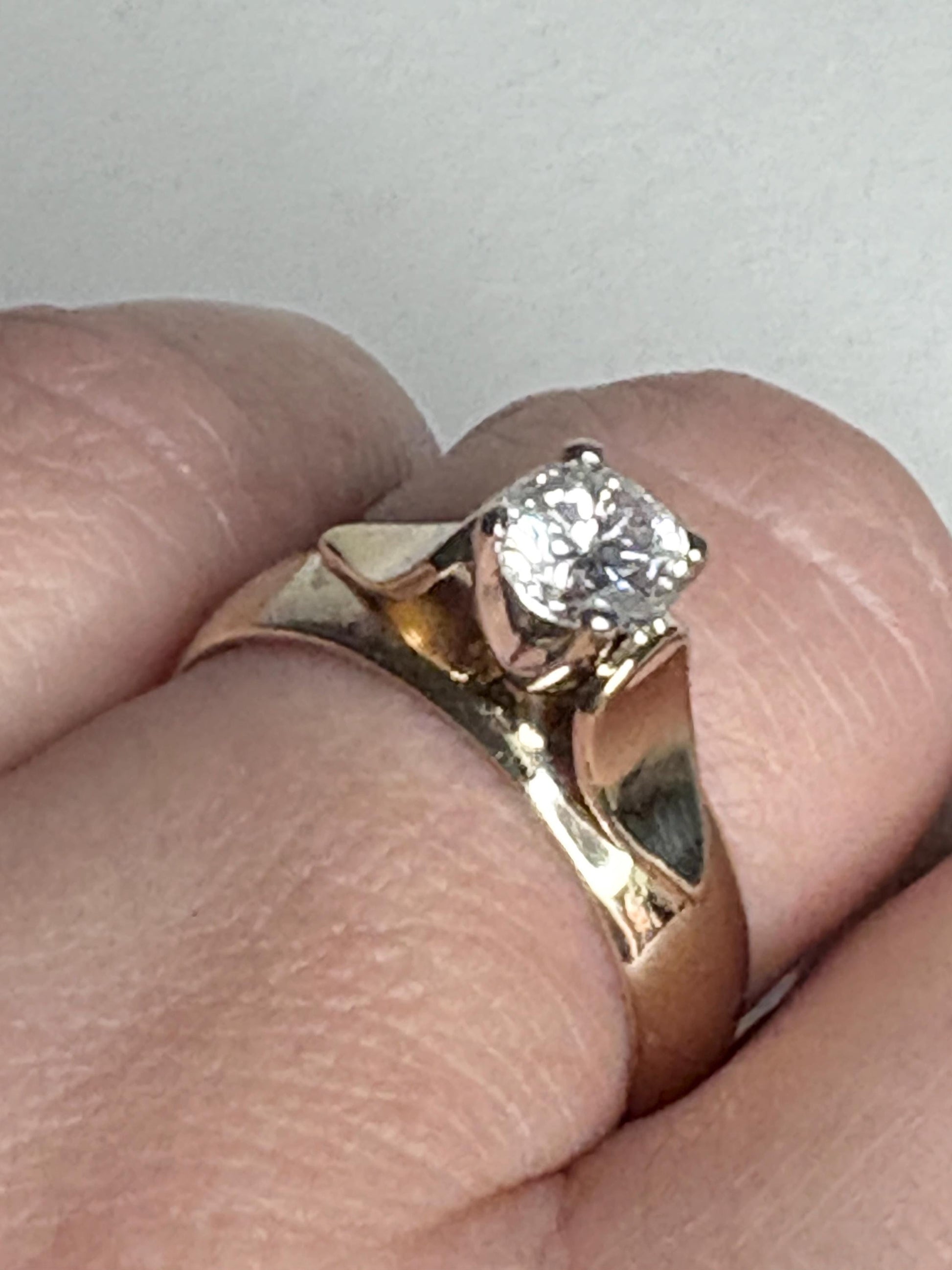 Vintage 14k gold band ring with a .75ct solitaire diamond.