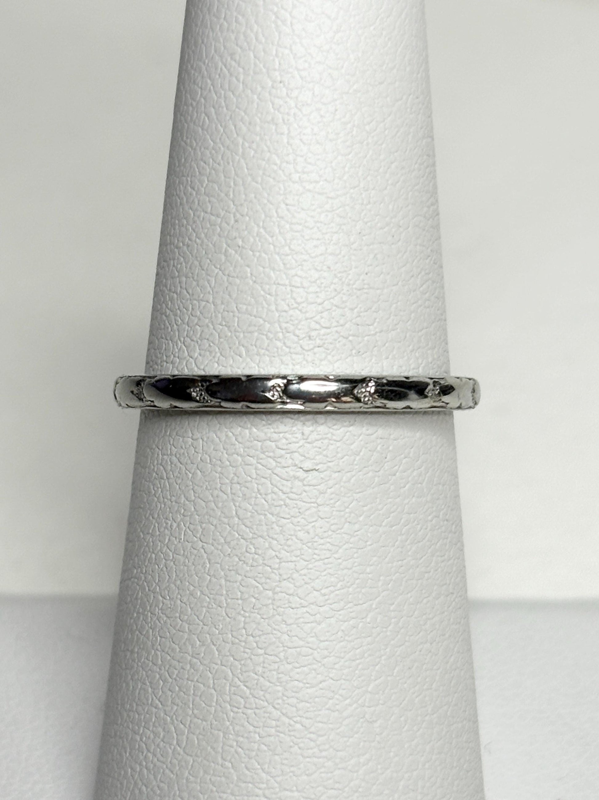 Retro 18k white gold chevron pattern band ring with small diamonds.
