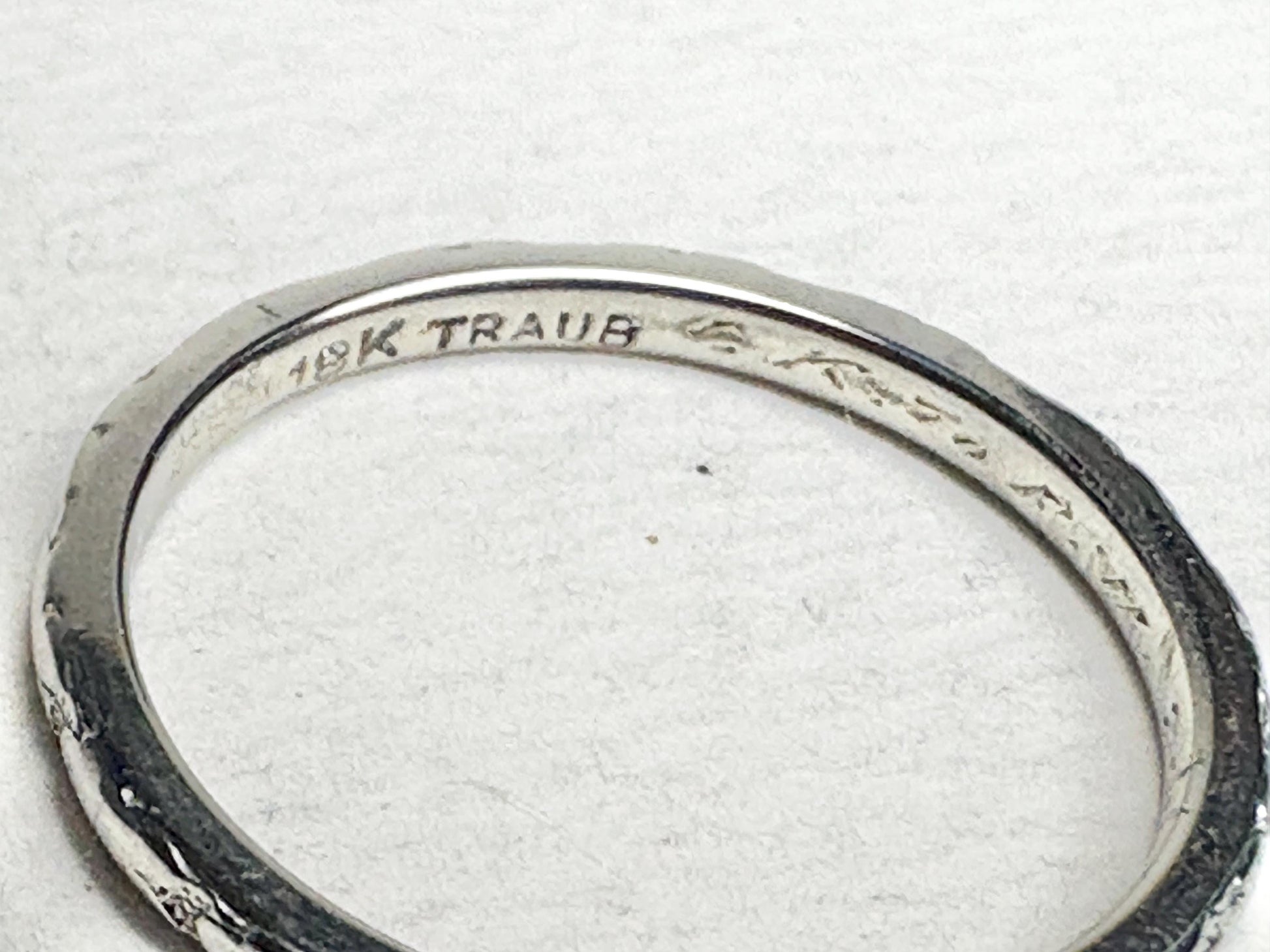 Retro 18k white gold chevron band ring with "18K TRAUB" inscription.