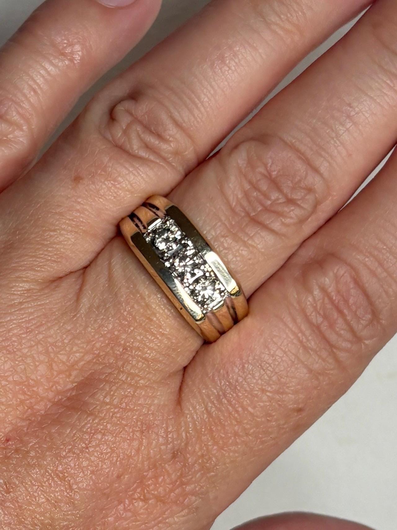 Men's 14k gold band ring with three champagne diamonds.