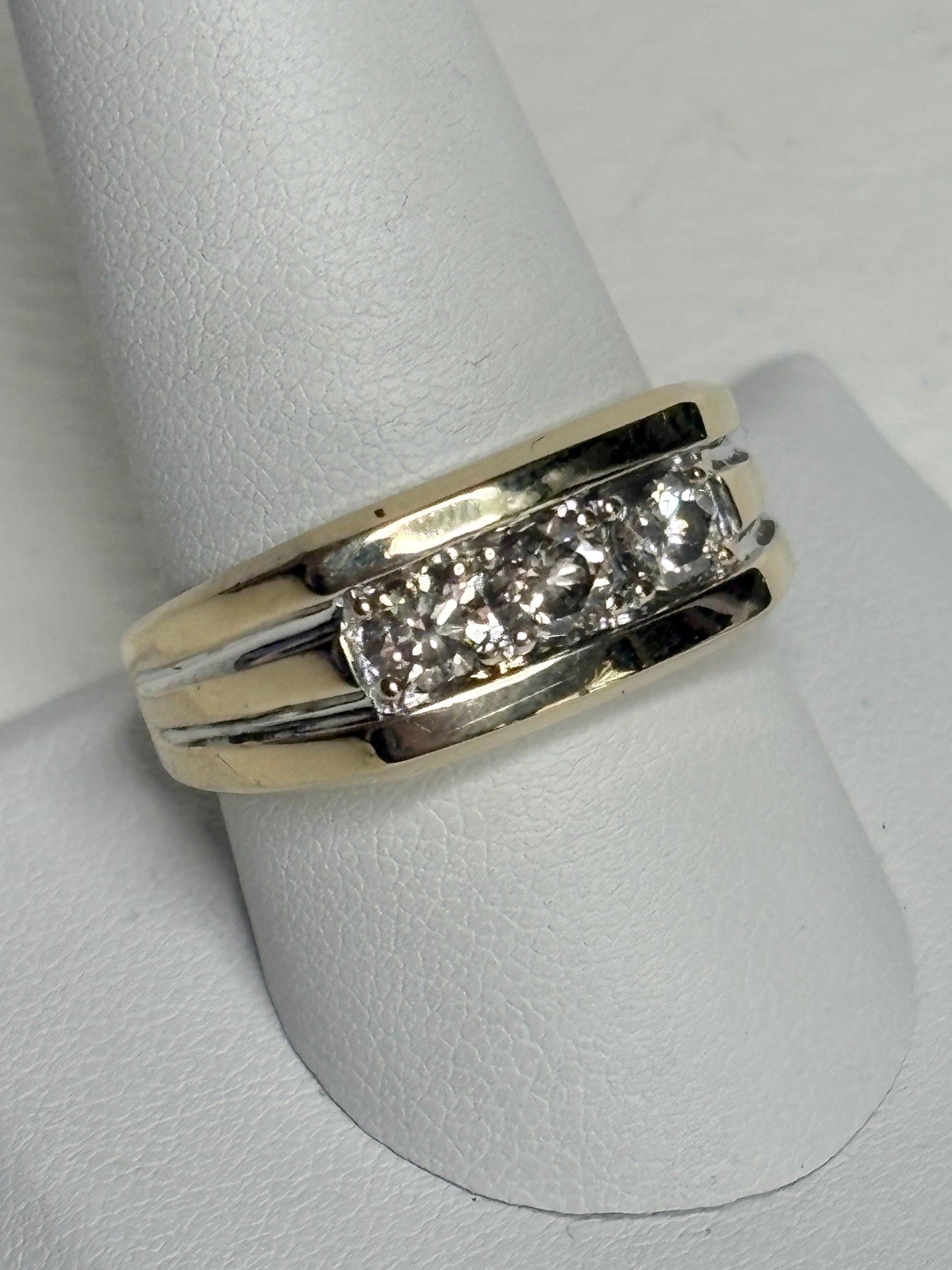 Men's 14k gold band ring with three champagne diamonds.