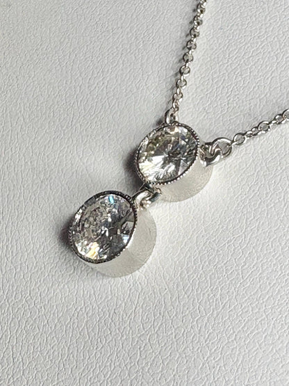 Custom double solitaire natural diamond necklace in 14k white gold.