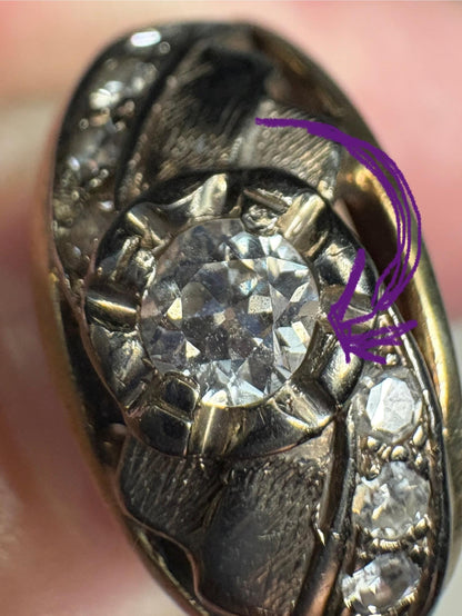 Mid-century 14k gold band with a central diamond and side diamonds.