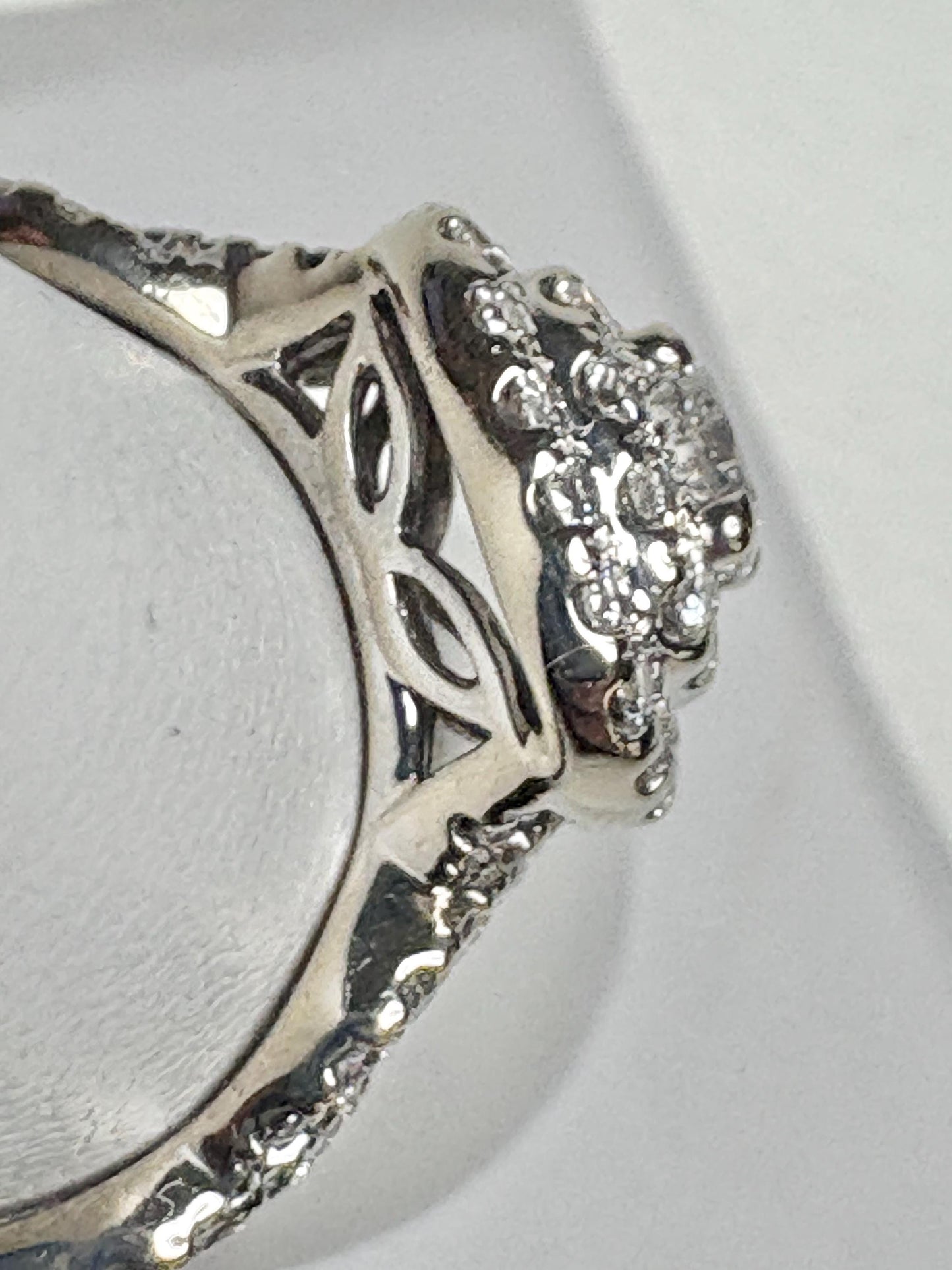 A white gold ring with a double halo of natural diamonds.
