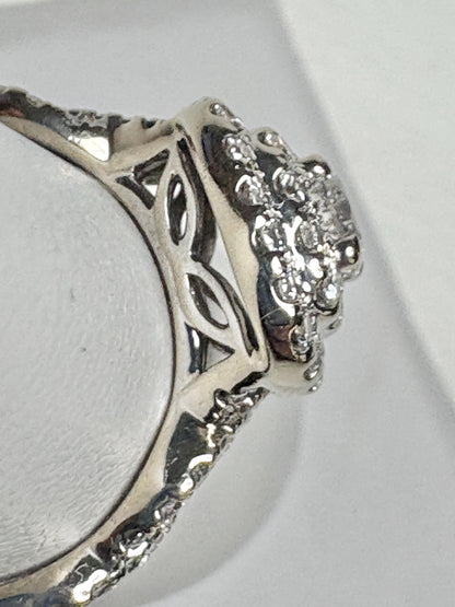 A white gold ring with a double halo of natural diamonds.
