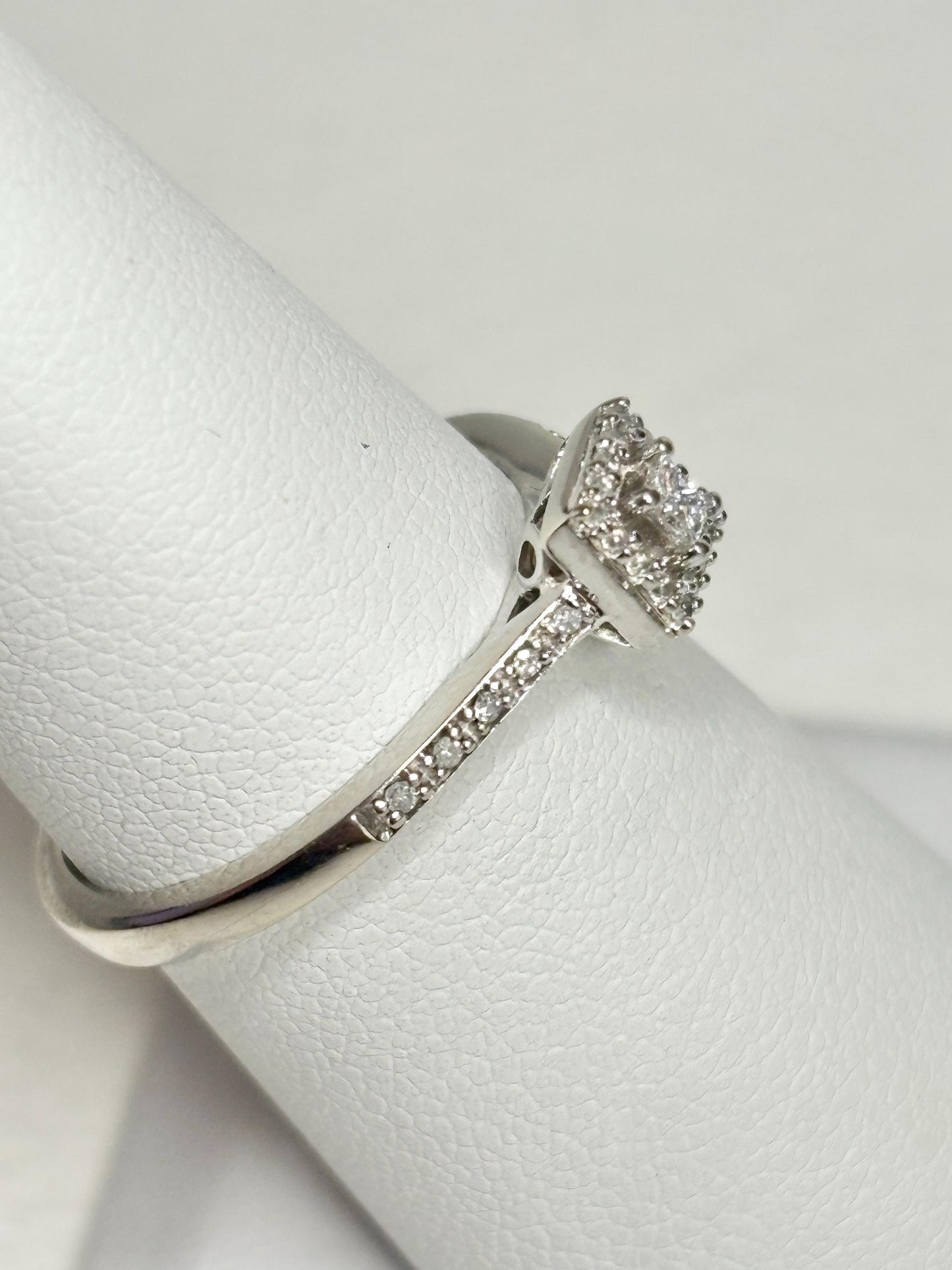 Princess cut diamond halo ring in 10k white gold.