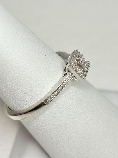 Princess cut diamond halo ring in 10k white gold.
