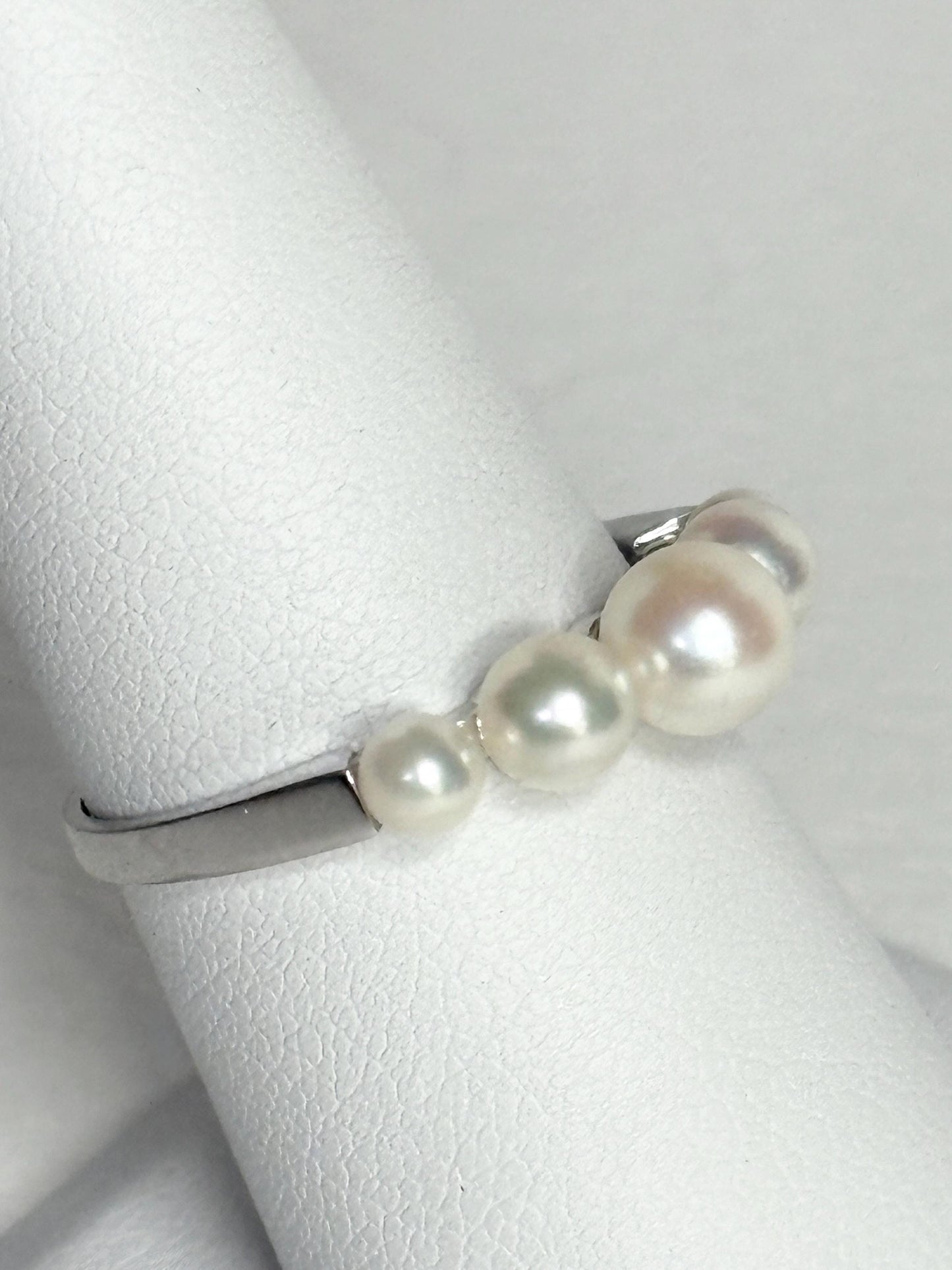 18k white gold band ring with five Japanese Akoya cultured pearls.