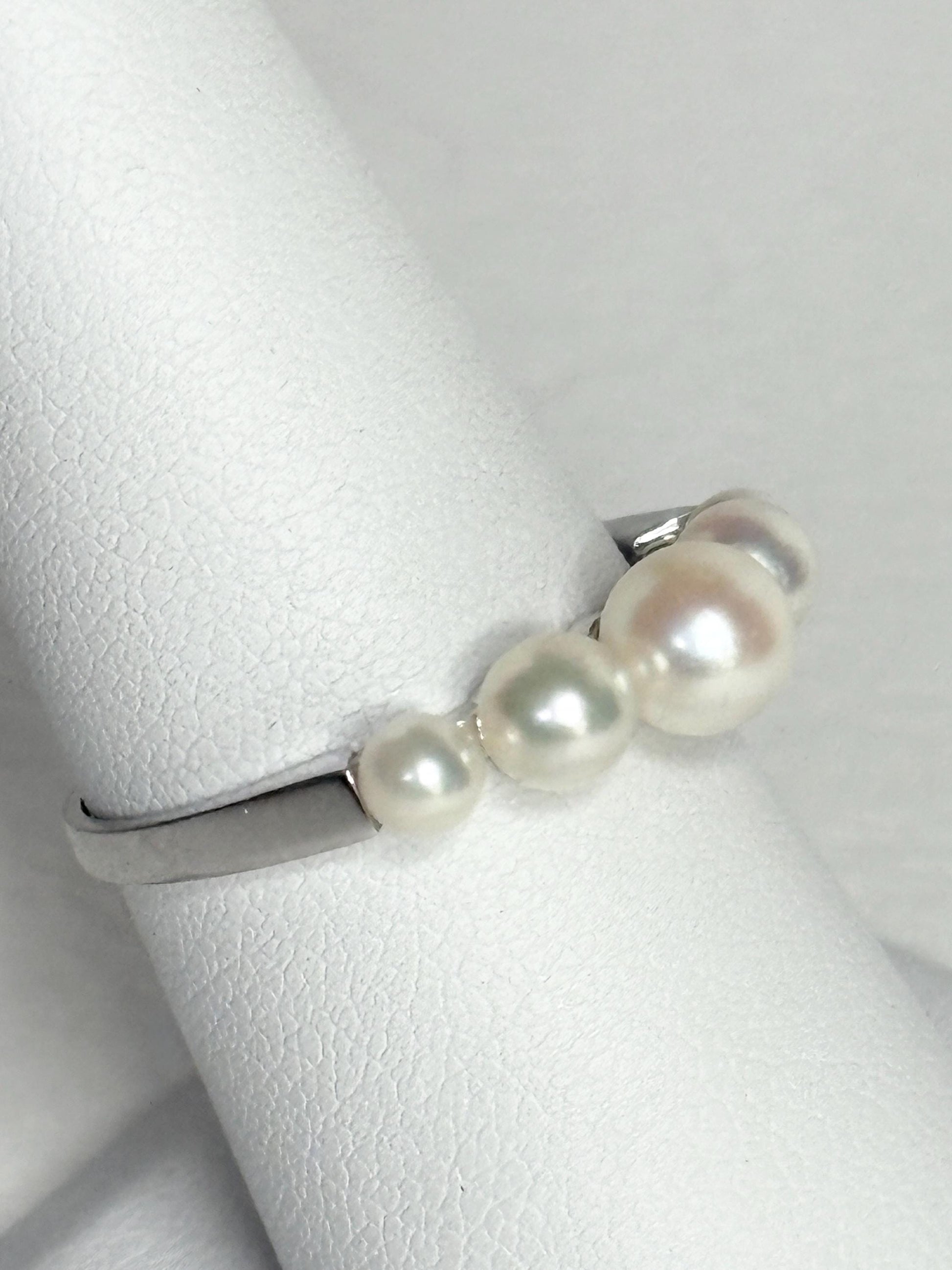18k white gold band ring with five Japanese Akoya cultured pearls.