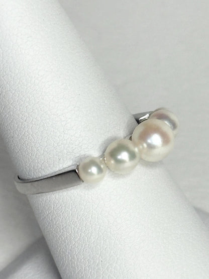 18k white gold band ring with five Japanese Akoya cultured pearls.