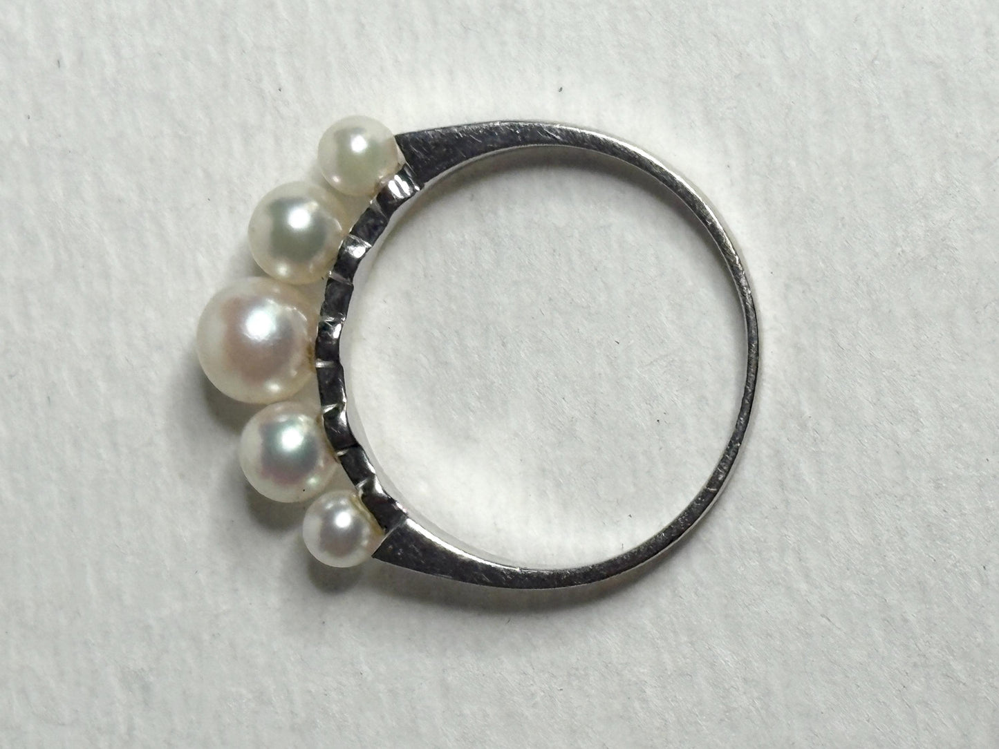 18k white gold band ring with five Japanese Akoya cultured pearls.