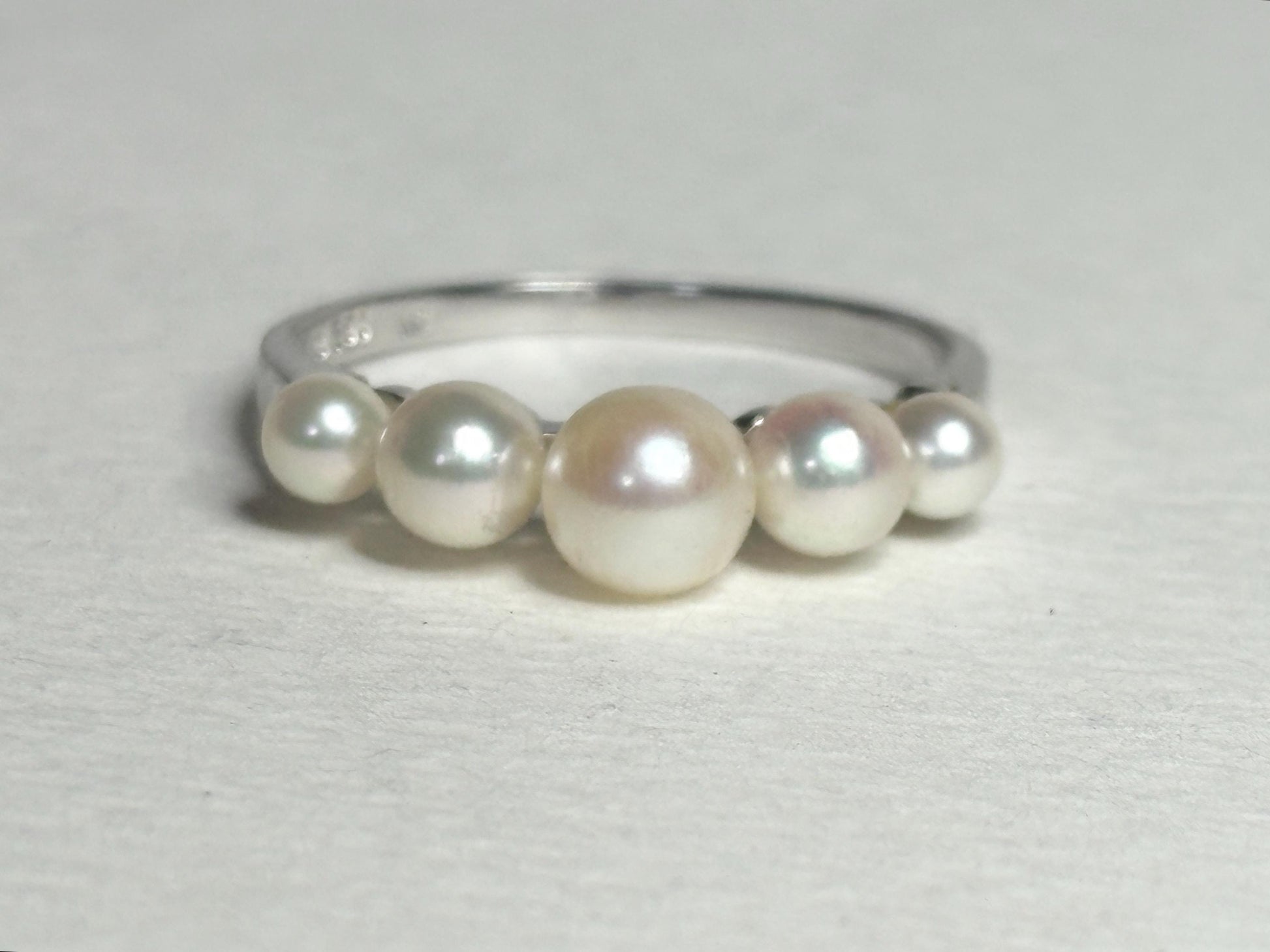 18k white gold band ring with five Japanese Akoya cultured pearls.