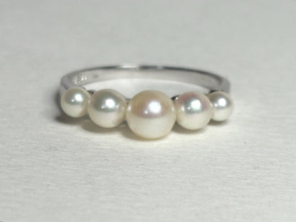 18k white gold band ring with five Japanese Akoya cultured pearls.