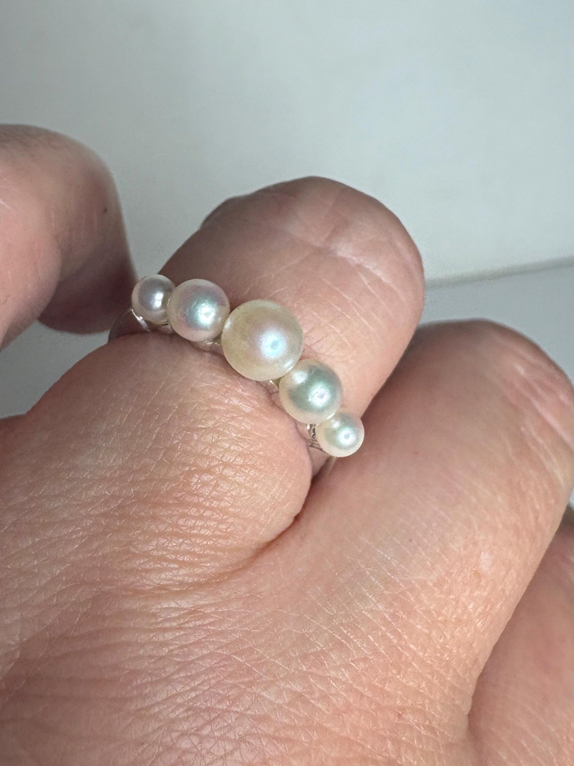 A delicate 18k white gold ring with five Akoya pearls.