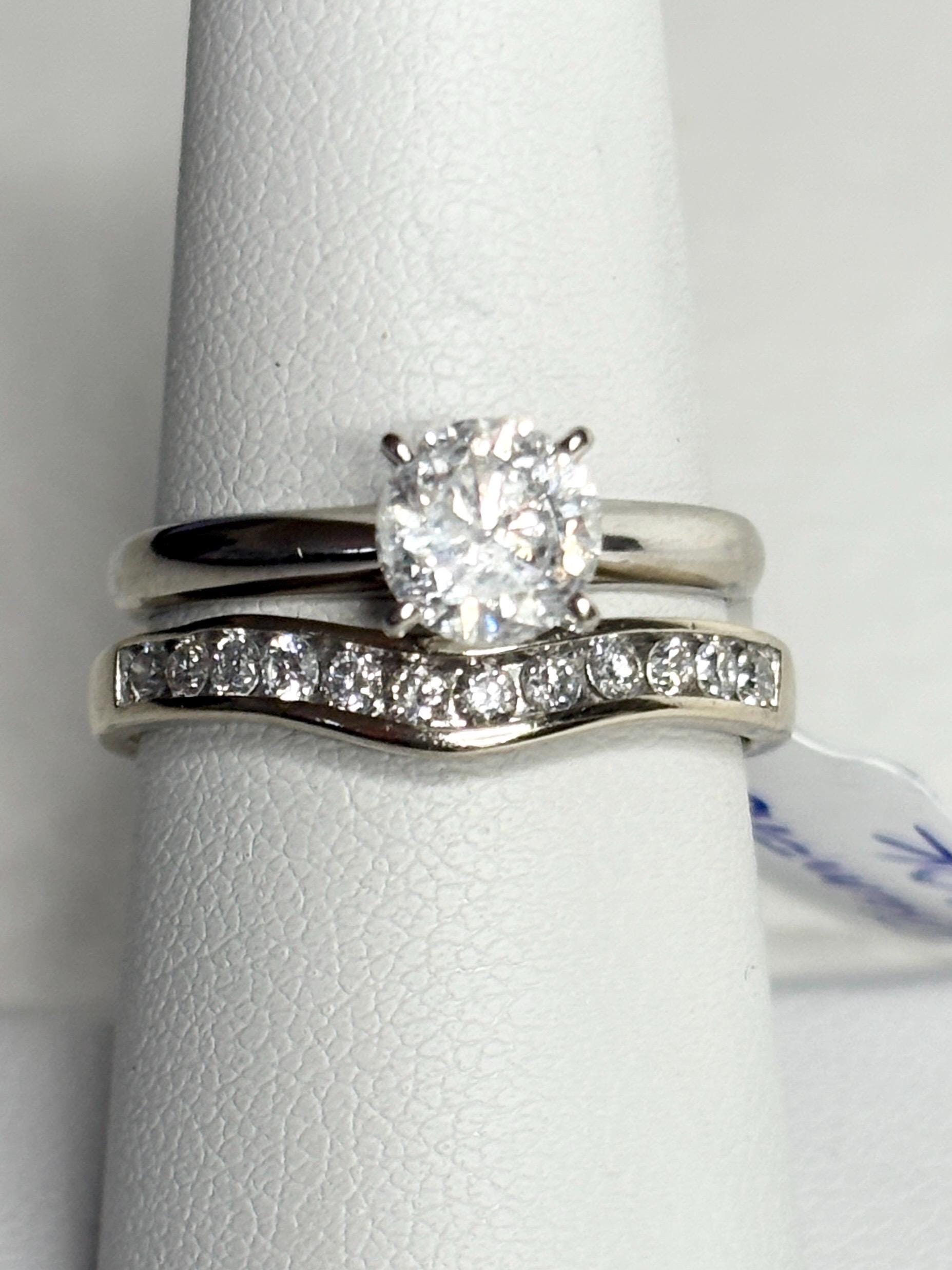 Contoured 14k white gold wedding band with channel-set diamonds.