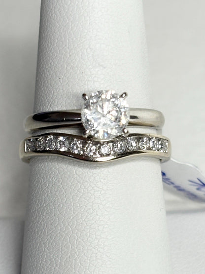 Contoured 14k white gold wedding band with channel-set diamonds.