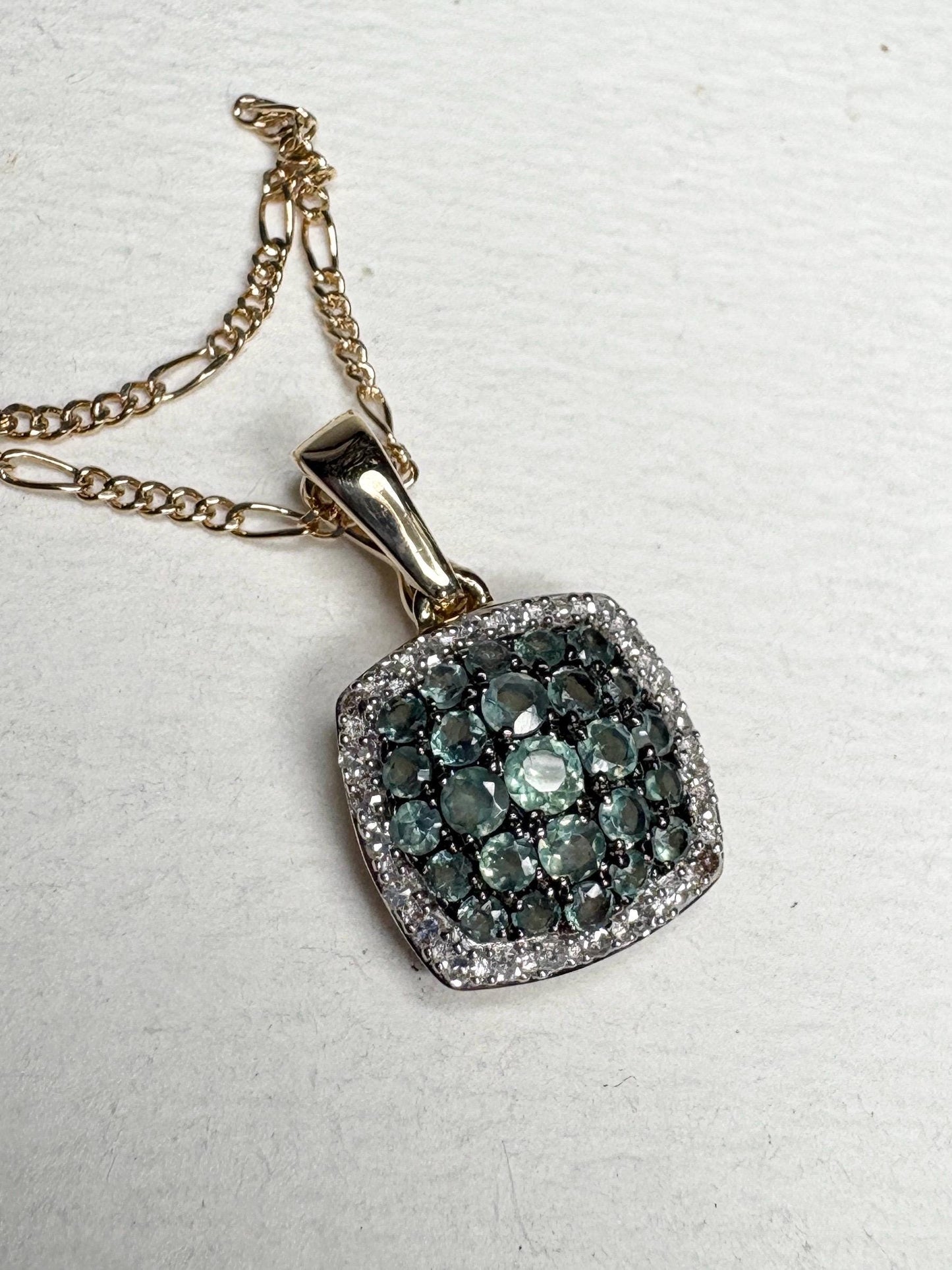 14k gold figaro necklace with a cushion cluster alexandrite and diamond halo pendant.