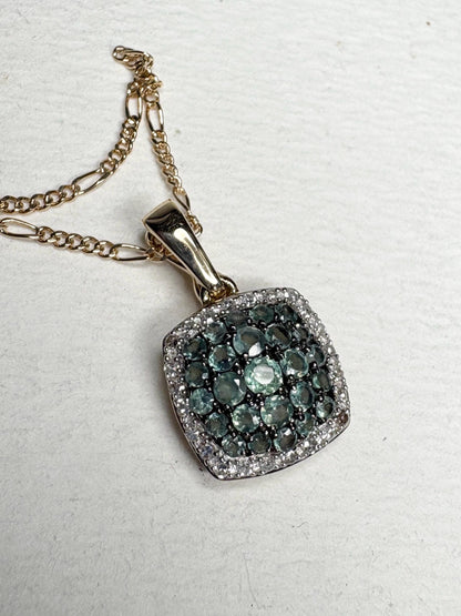 14k gold figaro necklace with a cushion cluster alexandrite and diamond halo pendant.