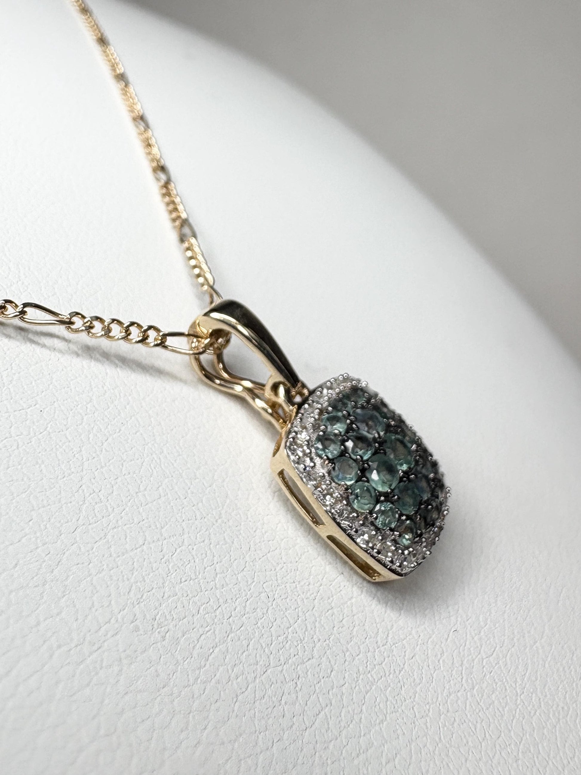 14k gold figaro necklace with a cushion cluster alexandrite and diamond halo pendant.