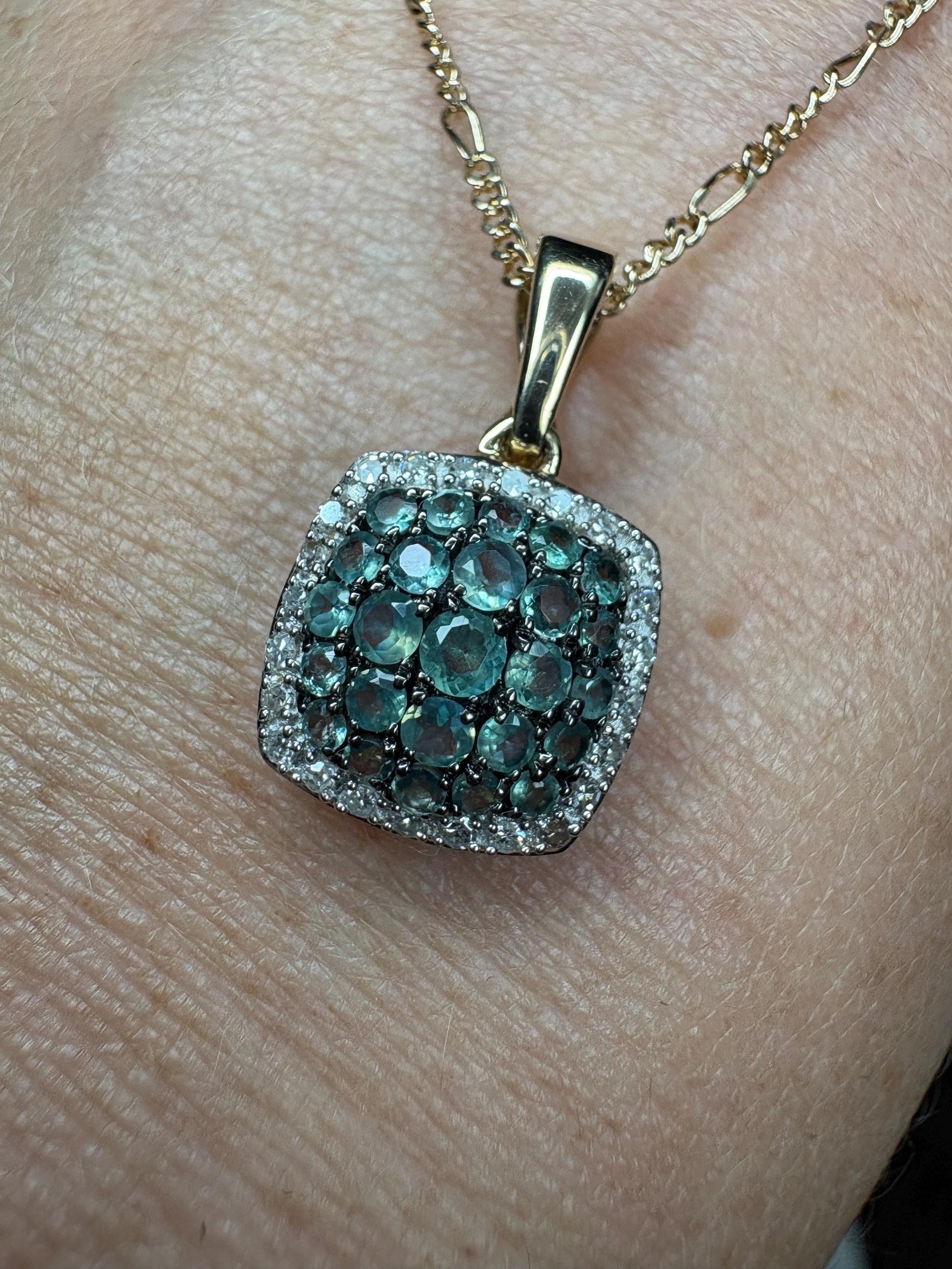 14k gold pendant necklace with a cushion cluster of alexandrite and diamond halo.