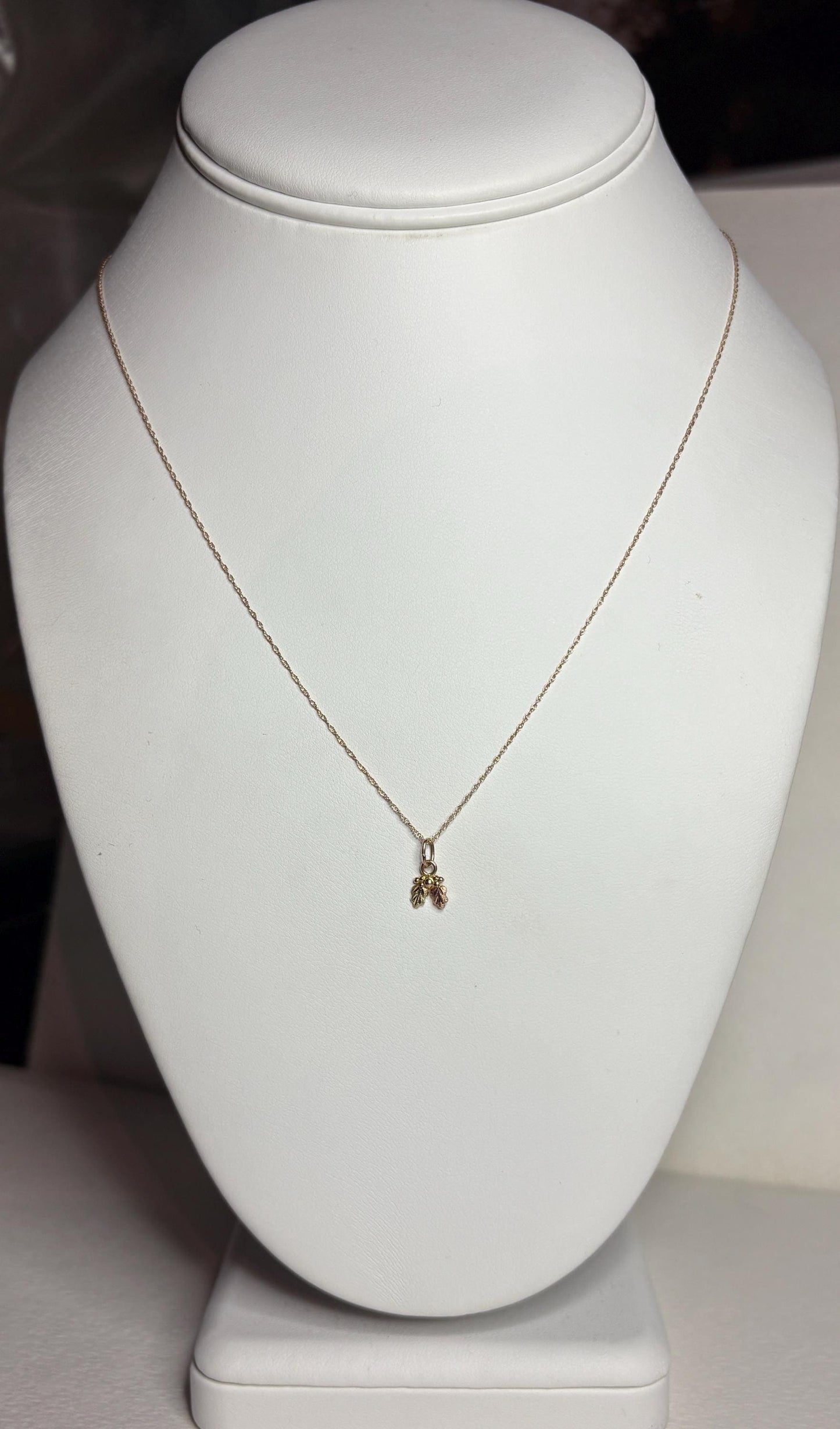 Dainty tiny Black Hills Gold pendant necklace in solid 10k gold on an 18-inch chain.