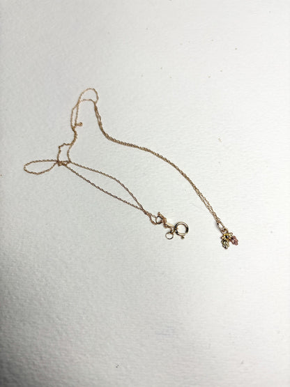 Dainty Black Hills Gold pendant necklace with three leaves on an 18-inch 10k gold chain.