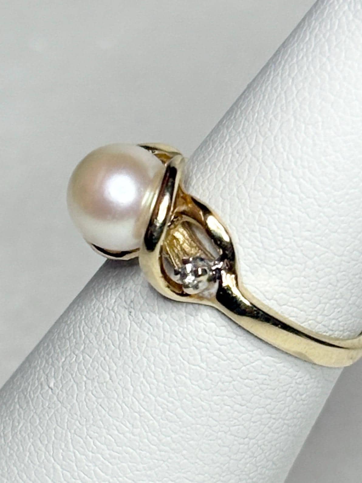 Akoya pearl and diamond ring in solid 10k gold.