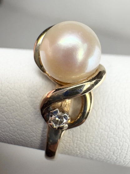 10k gold ring with a pearl and two diamonds.