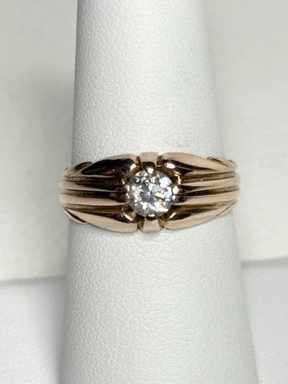 Vintage 10k rose gold ring with an old mine cut diamond on a wide band.
