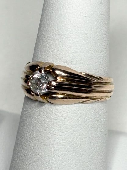 Vintage 10k rose gold ring with an old mine cut diamond on a wide band.